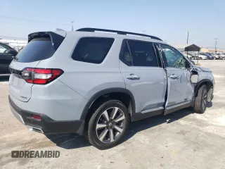 2023 Honda Pilot Touring with VIN 5FNYG2H7XPB011420, listed as a Copart auction lot 69799314 with 9,601 mi miles and Salvage Title. Bid and sale history available at carsss.com. Image 3.