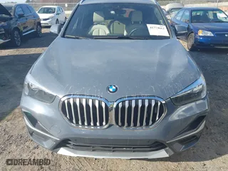 2021 BMW X1 xDrive28i with VIN WBXJG9C07M5T23053, listed as a IAAI auction lot 41774663 with 66,770 mi miles. Bid and sale history available at carsss.com. Image 6.