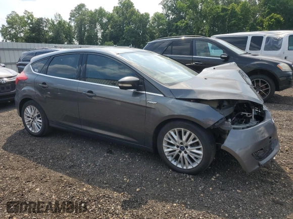 2018 Ford Focus Titanium z VIN 1FADP3N20JL271719, wystawiony jako Copart lot #60784755 z przebiegiem 116 118 mil mil oraz Szkoda całkowita • Salvage title. Historia ofert i sprzedaży dostępna na DreamBid. Obrazek 4.