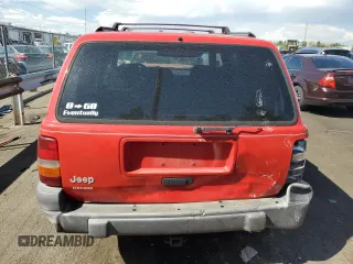 1996 Jeep Grand Cherokee Laredo with VIN 1J4GZ58S0TC170623, listed as a Copart auction lot 68019014 with 174,192 mi miles and Salvage Title. Bid and sale history available at carsss.com. Image 6.