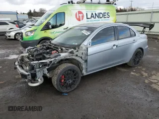 2014 Mitsubishi Lancer Evolution GSR with VIN JA32W8FVXEU000210, listed as a Copart auction lot 87228694 with 120,356 mi miles and Salvage Title. Bid and sale history available at carsss.com. Image 1.