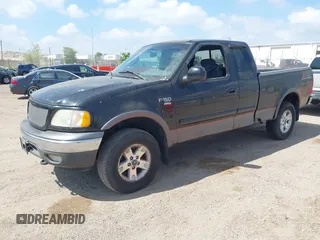 2002 Ford F-150 XL with VIN 1FTRX18L82NA18808, listed as a IAAI auction lot 42259883 with 154,519 mi miles and . Bid and sale history available at DreamBid. Image 2.
