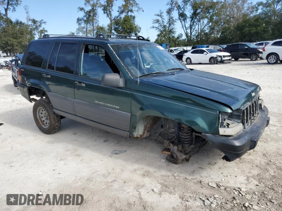 1996 Jeep Grand Cherokee Laredo with VIN 1J4GZ58S1TC340018, listed as a Copart auction lot 86571454 with 0 mi miles and Salvage Title. Bid and sale history available at carsss.com. Image 4.