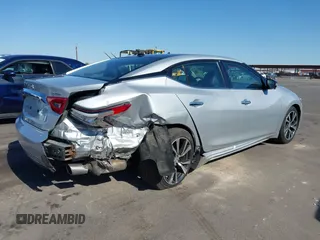 2016 Nissan Maxima SL z VIN 1N4AA6AP3GC377081, wystawiony jako IAAI lot #42235817 z przebiegiem 159 571 mil mil oraz . Historia ofert i sprzedaży dostępna na DreamBid. Obrazek 6.