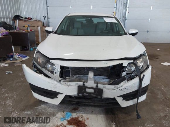 2017 Honda Civic LX with VIN 19XFC2F5XHE007668, listed as a IAAI auction lot 42219927 with 132,444 mi miles and . Bid and sale history available at DreamBid. Image 6.