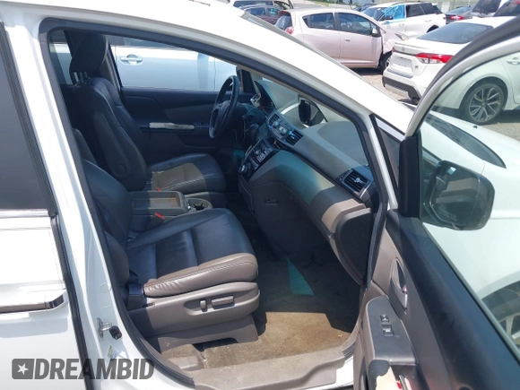 2012 Honda Odyssey EX-L with VIN 5FNRL5H63CB063684, listed as a IAAI auction lot 42576742 with 170,656 mi miles and . Bid and sale history available at DreamBid. Image 5.