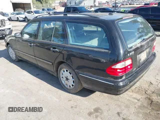 2001 Mercedes-Benz E-Class with VIN WDBJH65J31B381879, listed as a IAAI auction lot 41855504 with 153,667 mi miles. Bid and sale history available at carsss.com. Image 3.