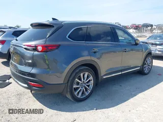 2020 Mazda CX-9 Grand Touring z VIN JM3TCADY8L0417775, wystawiony jako IAAI lot #42306864 z przebiegiem 35 287 mil mil oraz . Historia ofert i sprzedaży dostępna na DreamBid. Obrazek 4.