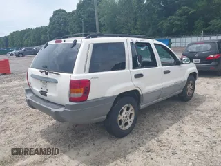 1999 Jeep Grand Cherokee Laredo with VIN 1J4GW58S3XC505985, listed as a IAAI auction lot 42399619 with 253,876 mi miles and . Bid and sale history available at DreamBid. Image 4.