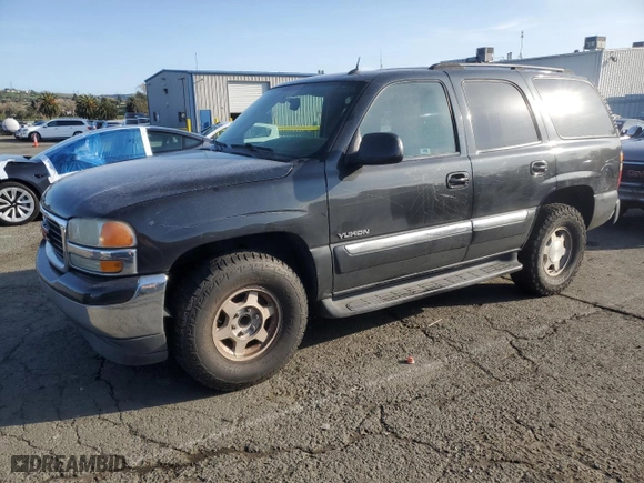 2005 GMC Yukon SLT with VIN 1GKEC13V95J163892, listed as a Copart auction lot 50243795 with 211,048 mi miles and Salvage Title. Bid and sale history available at carsss.com. Image 1.