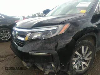 2021 Honda Pilot EX-L with VIN 5FNYF5H50MB011165, listed as a IAAI auction lot 39799892 with 95,040 mi miles and . Bid and sale history available at DreamBid. Image 6.