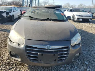 2005 Chrysler Sebring Limited with VIN 1C3EL65R25N662006, listed as a Copart auction lot 48552255 with 125,728 mi miles and Salvage Title. Bid and sale history available at DreamBid. Image 5.