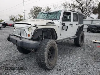 2012 Jeep Wrangler Unlimited Sport with VIN 1C4BJWDG9CL166830, listed as a Copart auction lot 86778254 with 121,657 mi miles and Salvage Title. Bid and sale history available at carsss.com. Image 1.