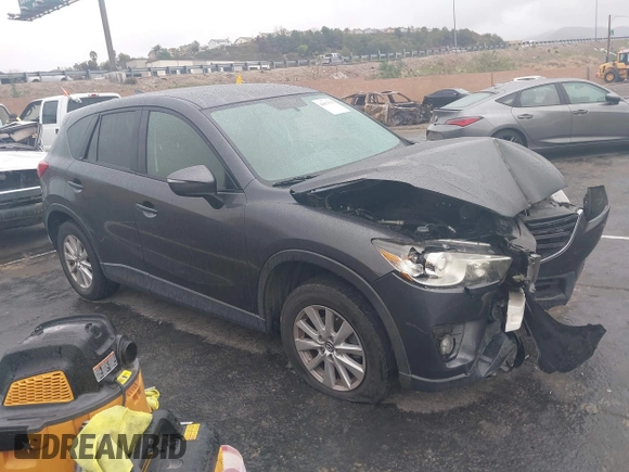 2016 Mazda CX-5 Touring with VIN JM3KE2CY7G0630056, listed as a IAAI auction lot 41817525 with 97,844 mi miles and . Bid and sale history available at DreamBid. Image 1.