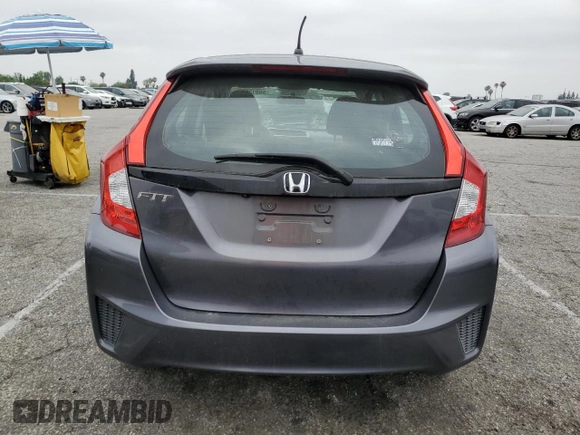 2015 Honda Fit LX z VIN 3HGGK5H58FM785137, wystawiony jako Copart lot #59013315 z przebiegiem 84 592 mil mil oraz Szkoda całkowita • Salvage title. Historia ofert i sprzedaży dostępna na DreamBid. Obrazek 6.