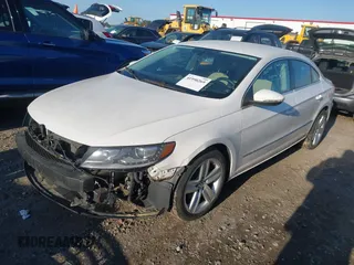 2014 Volkswagen CC R-Line with VIN WVWBP7AN0EE504680, listed as a IAAI auction lot 41990269 with 137,660 mi miles. Bid and sale history available at carsss.com. Image 2.