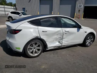 2023 Tesla Model Y Long Range z VIN 7SAYGDEE8PF816544, wystawiony jako Copart lot #57170485 z przebiegiem 74 598 mil mil oraz Szkoda całkowita • Salvage title. Historia ofert i sprzedaży dostępna na DreamBid. Obrazek 3.