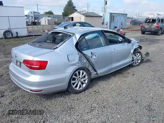 2015 Volkswagen Jetta Sedan 1.8T SE with VIN 3VWD17AJ3FM297573, listed as a IAAI auction lot 41884541 with 98,225 mi miles. Bid and sale history available at carsss.com. Image 4.