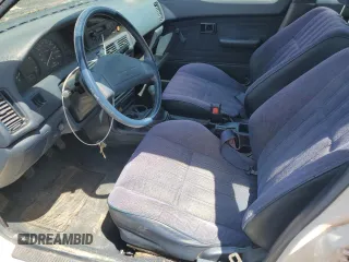1991 Toyota Corolla z VIN JT2AE94A6M3427211, wystawiony jako Copart lot #60075885 z przebiegiem 179 936 mil mil oraz Czysty tytuł • Clean title. Historia ofert i sprzedaży dostępna na DreamBid. Obrazek 7.