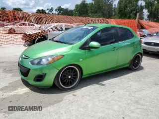 2012 Mazda 2 Sport with VIN JM1DE1KZ5C0141784, listed as a Copart auction lot 56498295 with 132,602 mi miles and Salvage Title. Bid and sale history available at DreamBid. Image 1.