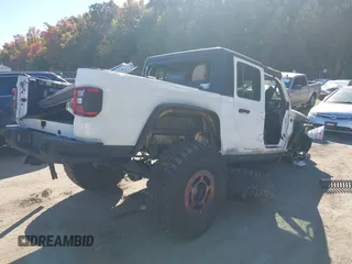 2020 Jeep Gladiator Sport S with VIN 1C6HJTAG3LL109494, listed as a IAAI auction lot 40677949 with 52,079 mi miles and . Bid and sale history available at DreamBid. Image 4.