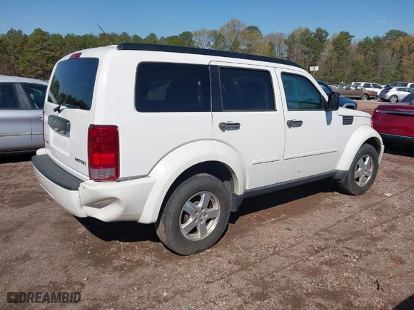 2009 Dodge Nitro SE with VIN 1D8GT28K19W518279, listed as a IAAI auction lot 41855238 with 186,607 mi miles. Bid and sale history available at carsss.com. Image 4.