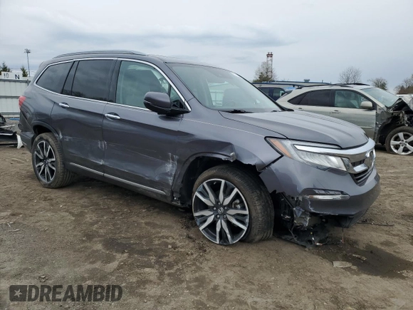 2020 Honda Pilot Touring 7-Passenger z VIN 5FNYF6H69LB005829, wystawiony jako Copart lot #52702555 z przebiegiem 90 746 mil mil oraz Szkoda całkowita • Salvage title. Historia ofert i sprzedaży dostępna na DreamBid. Obrazek 4.