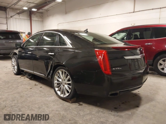 2014 Cadillac XTS Platinum with VIN 2G61W5S88E9186969, listed as a IAAI auction lot 41422872 with 184,998 mi miles and . Bid and sale history available at DreamBid. Image 3.