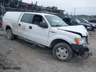 2013 Ford F-150 XL with VIN 1FTFW1CF7DFD53126, listed as a IAAI auction lot 41525709 with 136,137 mi miles. Bid and sale history available at carsss.com. Image 1.