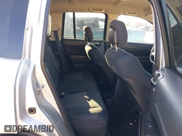 2011 Jeep Compass with VIN 1J4NT1FA7BD142600, listed as a IAAI auction lot 41590661 with 266,600 mi miles. Bid and sale history available at carsss.com. Image 5.