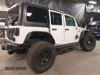 2017 Jeep Wrangler Unlimited Sport with VIN 1C4BJWDG9HL565213, listed as a IAAI auction lot 40999452 with 50,586 mi miles. Bid and sale history available at carsss.com. Image 4.