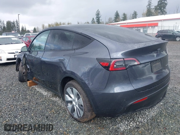 2023 Tesla Model Y Long Range with VIN 7SAYGAEE4PF871281, listed as a IAAI auction lot 41989805 with 15,501 mi miles. Bid and sale history available at carsss.com. Image 3.