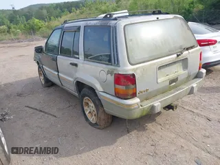 1994 Jeep Grand Cherokee Laredo z VIN 1J4GZ58Y1RC265589, wystawiony jako IAAI lot #42142226 z przebiegiem 138 656 mil mil oraz . Historia ofert i sprzedaży dostępna na DreamBid. Obrazek 3.