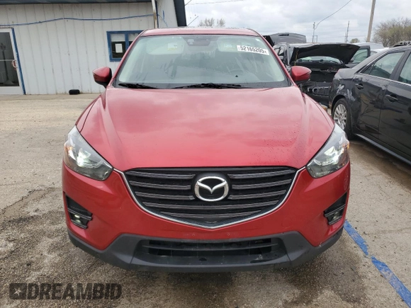 2016 Mazda CX-5 Grand Touring with VIN JM3KE4DY5G0660201, listed as a Copart auction lot 52165205 with 108,231 mi miles and Salvage Title. Bid and sale history available at DreamBid. Image 5.