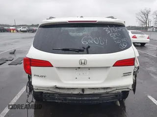2016 Honda Pilot Touring with VIN 5FNYF6H95GB062089, listed as a IAAI auction lot 41810378 with 74,704 mi miles and . Bid and sale history available at DreamBid. Image 16.