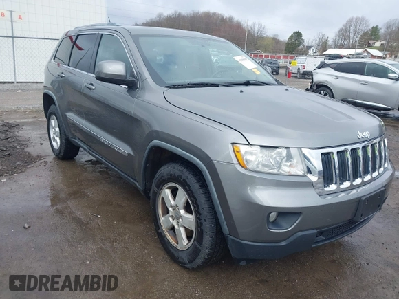 2012 Jeep Grand Cherokee Laredo with VIN 1C4RJFAGXCC118823, listed as a IAAI auction lot 41808398 with 153,509 mi miles. Bid and sale history available at carsss.com. Image 1.