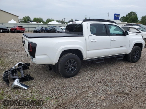 2023 Toyota Tacoma SR with VIN 3TMCZ5AN2PM642205, listed as a Copart auction lot 61045955 with 10,596 mi miles and Salvage title. Bid and sale history available at DreamBid. Image 3.