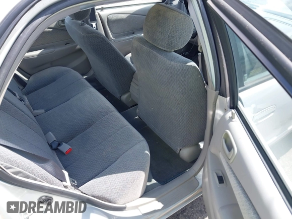 2002 Toyota Corolla CE with VIN 1NXBR12E12Z581660, listed as a IAAI auction lot 42654124 with 115,950 mi miles and . Bid and sale history available at DreamBid. Image 8.