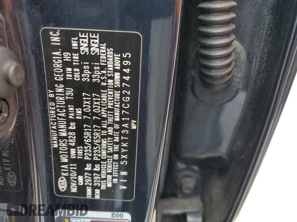 2012 Kia Sorento LX z VIN 5XYKT3A17CG274495, wystawiony jako Copart lot #56321925 z przebiegiem 130 439 mil mil oraz Szkoda całkowita • Salvage title. Historia ofert i sprzedaży dostępna na DreamBid. Obrazek 13.