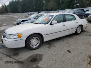 2001 Lincoln Town Car Executive z VIN 1LNHM81W91Y729914, wystawiony jako Copart lot #41593085 z przebiegiem 144 950 mil mil oraz Czysty tytuł • Clean title. Historia ofert i sprzedaży dostępna na DreamBid. Obrazek 1.