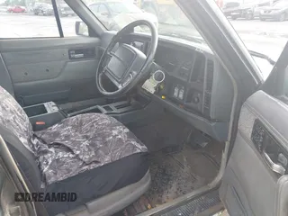 1995 Jeep Cherokee with VIN 1J4FN68S7SL656597, listed as a IAAI auction lot 42028053 with 364,364 mi miles and . Bid and sale history available at DreamBid. Image 5.
