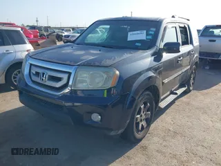 2011 Honda Pilot Touring with VIN 5FNYF4H92BB090056, listed as a IAAI auction lot 42010682 with 201,640 mi miles. Bid and sale history available at carsss.com. Image 20.