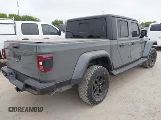 2022 Jeep Gladiator Willys with VIN 1C6JJTAMXNL137237, listed as a IAAI auction lot 41947651 with 55,199 mi miles and . Bid and sale history available at DreamBid. Image 4.
