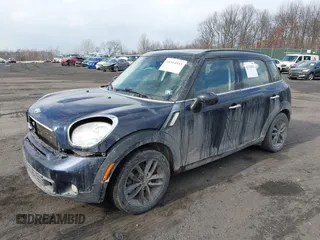 2013 MINI Countryman S ALL4 with VIN WMWZC5C58DWP30936, listed as a IAAI auction lot 41314553 with 128,405 mi miles and . Bid and sale history available at DreamBid. Image 2.