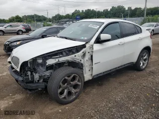 2014 BMW X6 xDrive35i with VIN 5UXFG2C59E0C45459, listed as a Copart auction lot 63804334 with 302,443 mi miles and Salvage Title. Bid and sale history available at carsss.com. Image 1.
