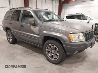 2000 Jeep Grand Cherokee Laredo z VIN 1J4GW48N9YC232346, wystawiony jako IAAI lot #42266120 z przebiegiem 152 239 mil mil oraz . Historia ofert i sprzedaży dostępna na DreamBid. Obrazek 1.