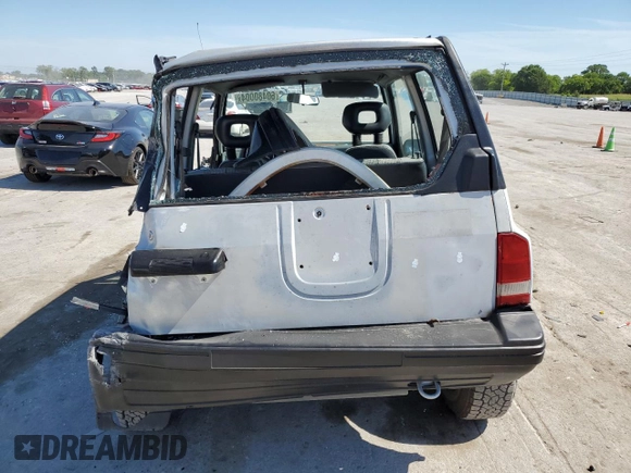 1991 Geo Tracker z VIN 2CNBJ18U3M6909006, wystawiony jako Copart lot #73638944 z przebiegiem 65 033 mil mil oraz Tytuł czysty. Historia ofert i sprzedaży dostępna na DreamBid. Obrazek 6.