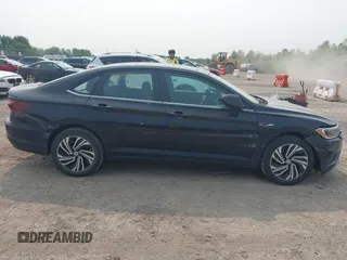 2020 Volkswagen Jetta SEL z VIN 3VWEB7BU9LM023817, wystawiony jako IAAI lot #42371694 z przebiegiem 99 100 mil mil oraz . Historia ofert i sprzedaży dostępna na DreamBid. Obrazek 13.