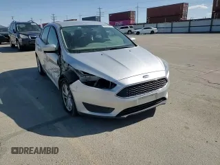 2018 Ford Focus SE z VIN 1FADP3F29JL206110, wystawiony jako Copart lot #53953515 z przebiegiem 80 841 mil mil oraz Szkoda całkowita • Salvage title. Historia ofert i sprzedaży dostępna na DreamBid. Obrazek 14.