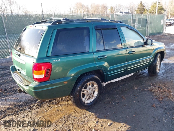 1999 Jeep Grand Cherokee Limited with VIN 1J4GW68S1XC555399, listed as a IAAI auction lot 41764099 with 1 mi miles. Bid and sale history available at carsss.com. Image 4.
